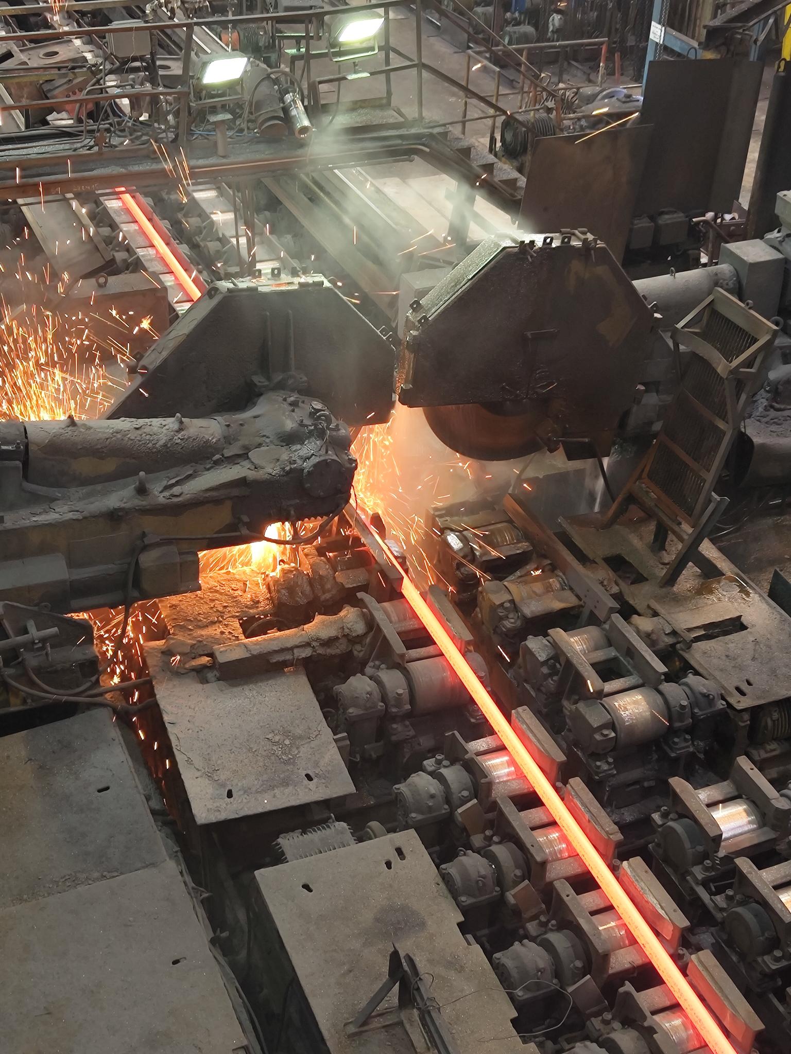 Hot steel moving through a cutting line
